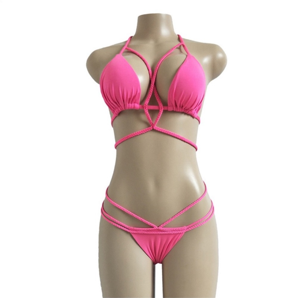 Hot pink/fushia Very strappy bikini. Super sexy NWOT! Size large- never worn.